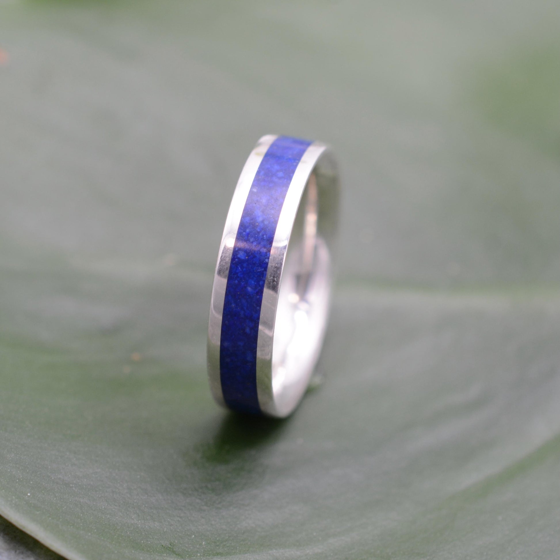 a wedding ring with a blue stripe on it
