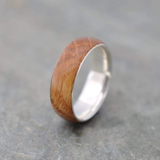 Siempre bourbon barrel ring with sterling silver showing wood grain