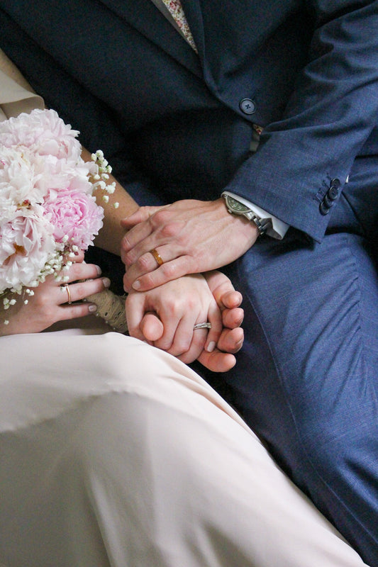 Wood Wedding Band Couple Holding Hands