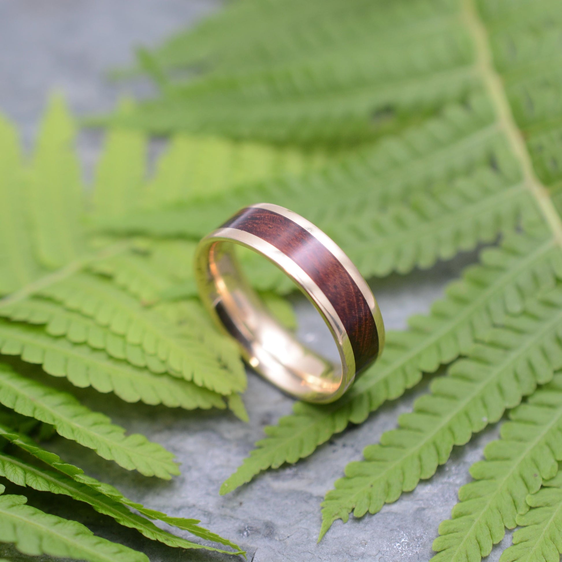Lados comfort fit wood wedding band with reddish-brown Guapinol and recycled yellow gold