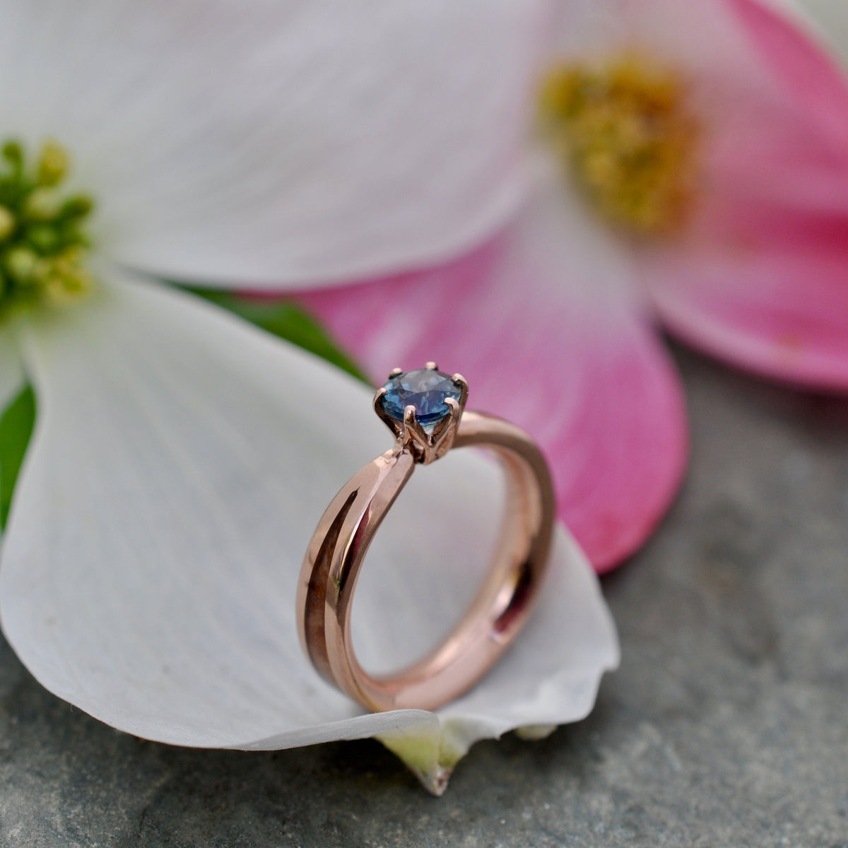 Aquamarine wood engagement ring with Kentucky walnut and recycled rose gold tapered band close up of grain