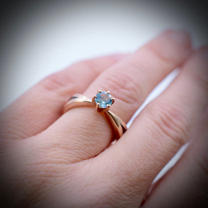 Aquamarine wood engagement ring with Kentucky walnut and recycled rose gold tapered band worn on hand