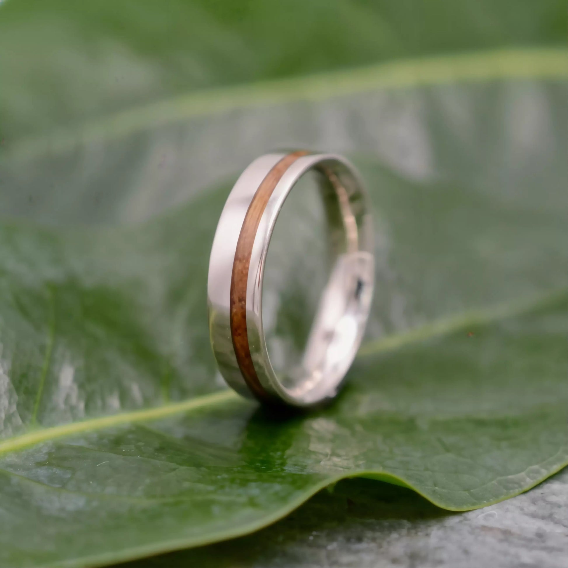 Equinox bourbon barrel wood wedding band showing comfort fit interior