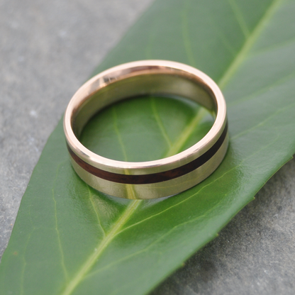Side view of comfort fit yellow gold wood wedding band with cocobolo