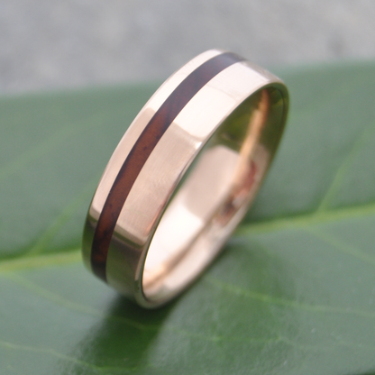Sustainable wood wedding band made with 14k recycled yellow gold