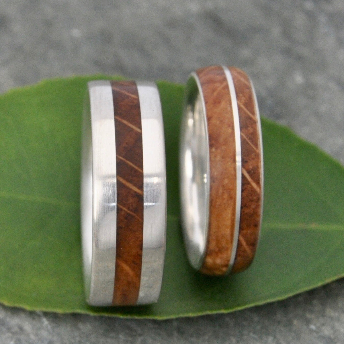 Symmetric bourbon barrel wedding band with sterling silver and white oak