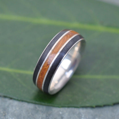 Sustainable wedding band with reclaimed bourbon barrel and titanium sand