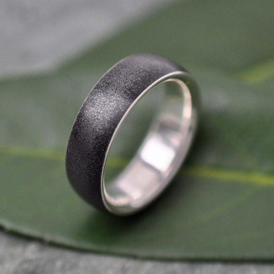 Sterling silver ring with volcanic black titanium sand, Siempre design