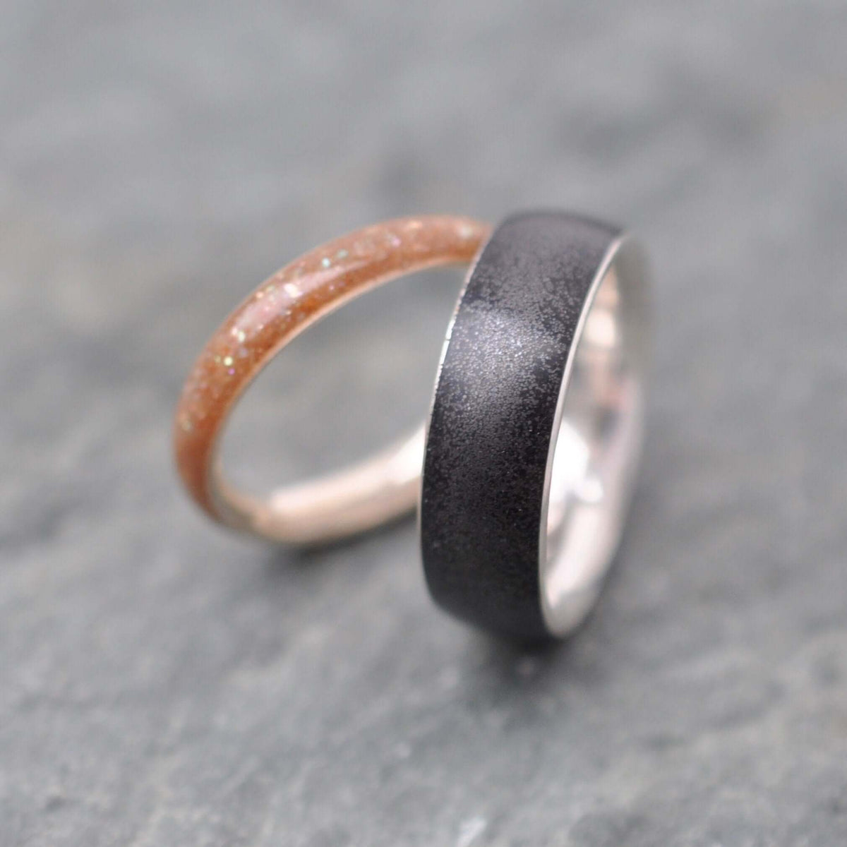 Volcanic sand and silver ring showing magnetic sand detail