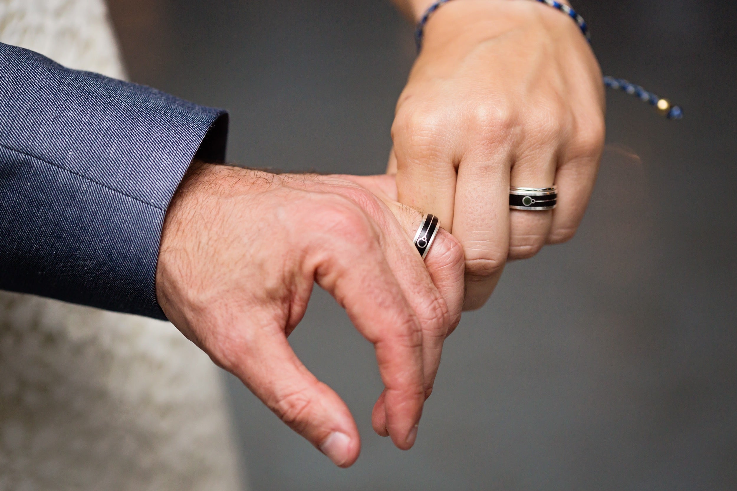 custom organic wood rings on wedding day
