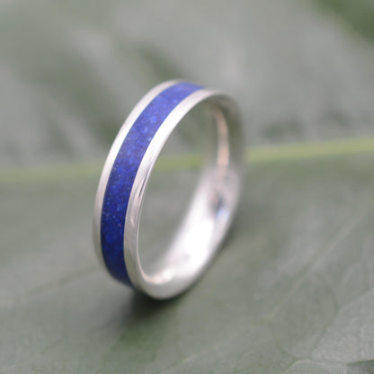 a wedding ring with a blue stripe on it