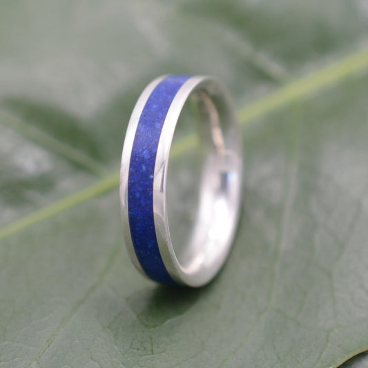 a wedding ring with a blue stripe on it