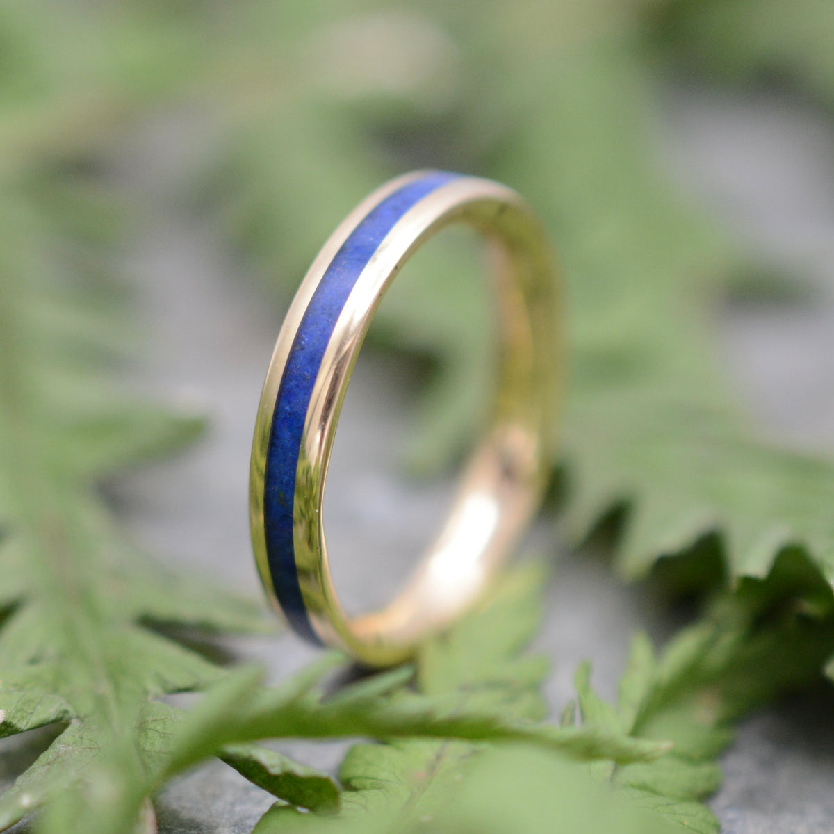 Yellow gold Lados lapis lazuli ring showing blue stone and gold detail
