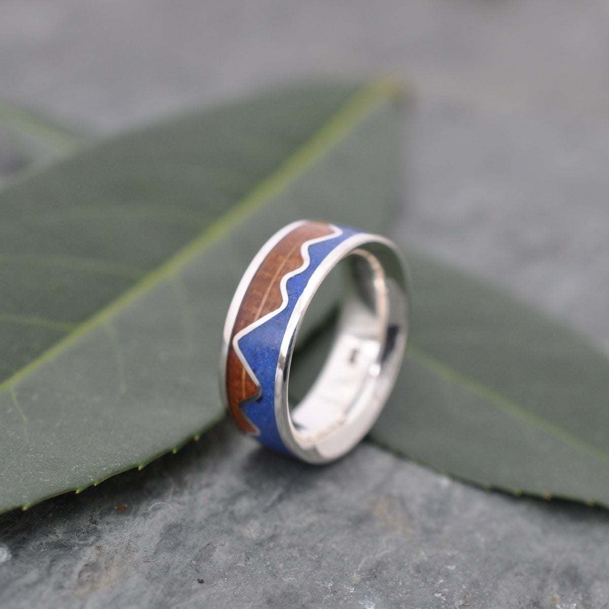 Lapis Lazuli Mountain Ring, Bourbon Barrel Wood and Sterling Silver on leaves, showcasing a unique wood wedding ring design.