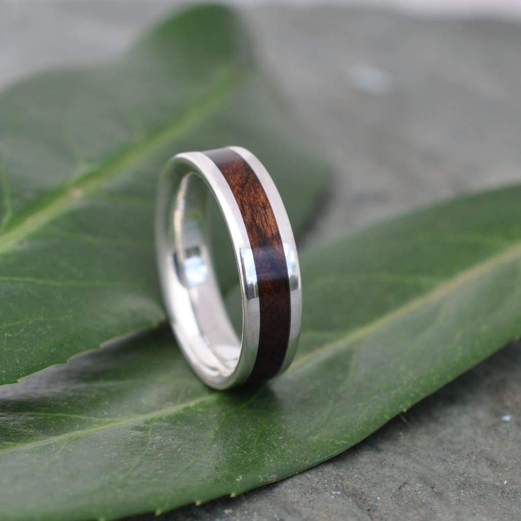 Wood and silver ring set showing laurel macho grain and silver detail