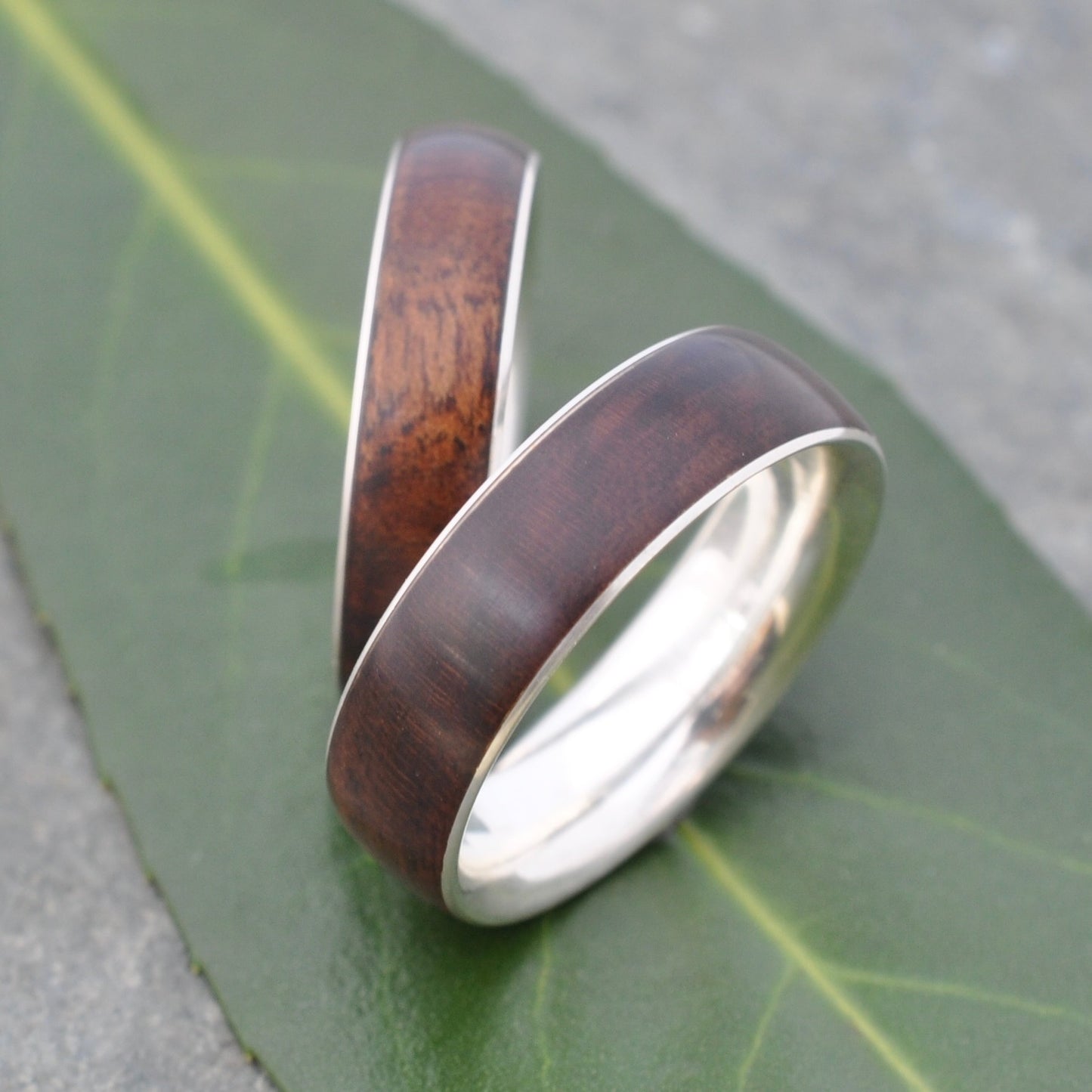 matching set of wood wedding rings with 14k white gold