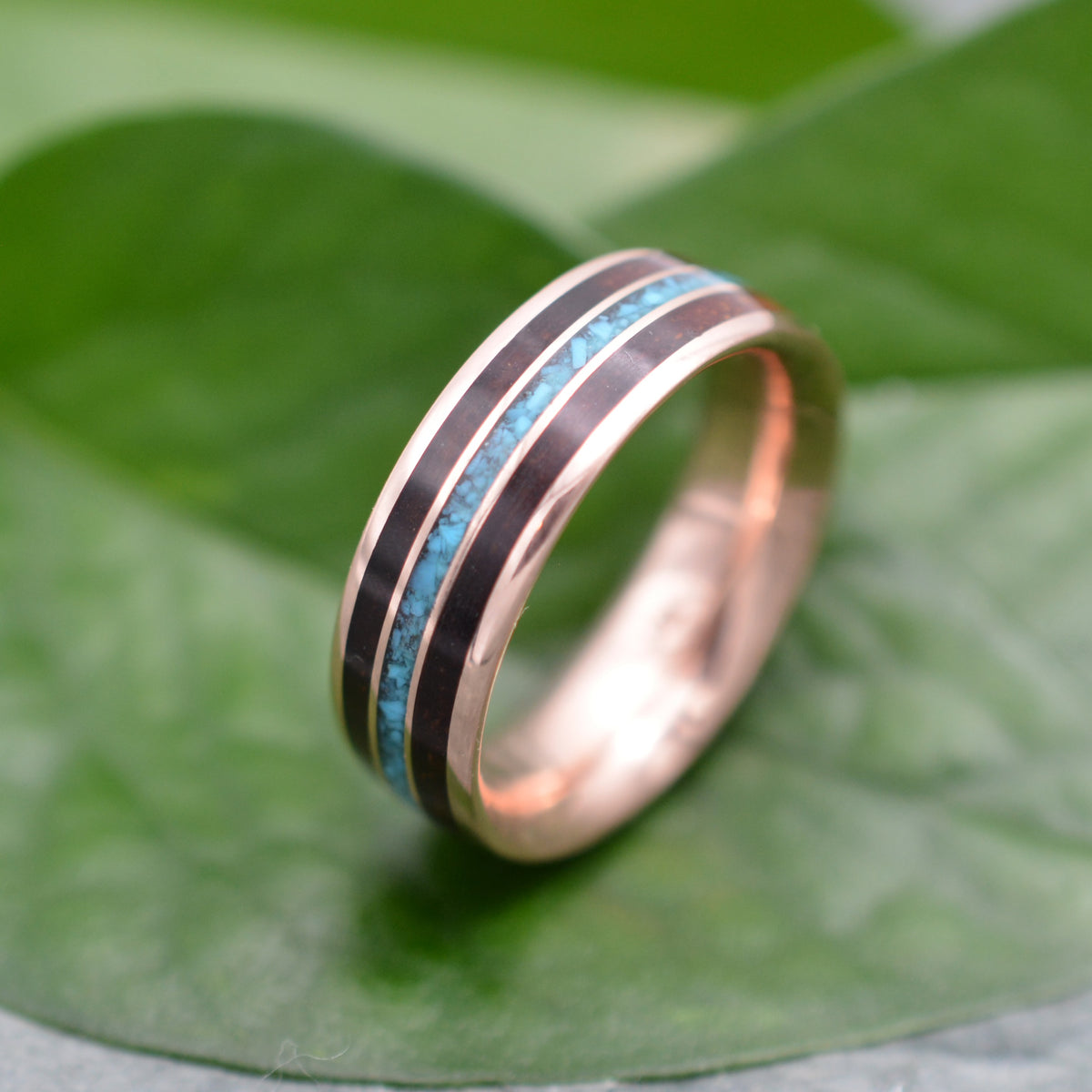Meridian rose gold ring showing turquoise, koa and rose gold composition