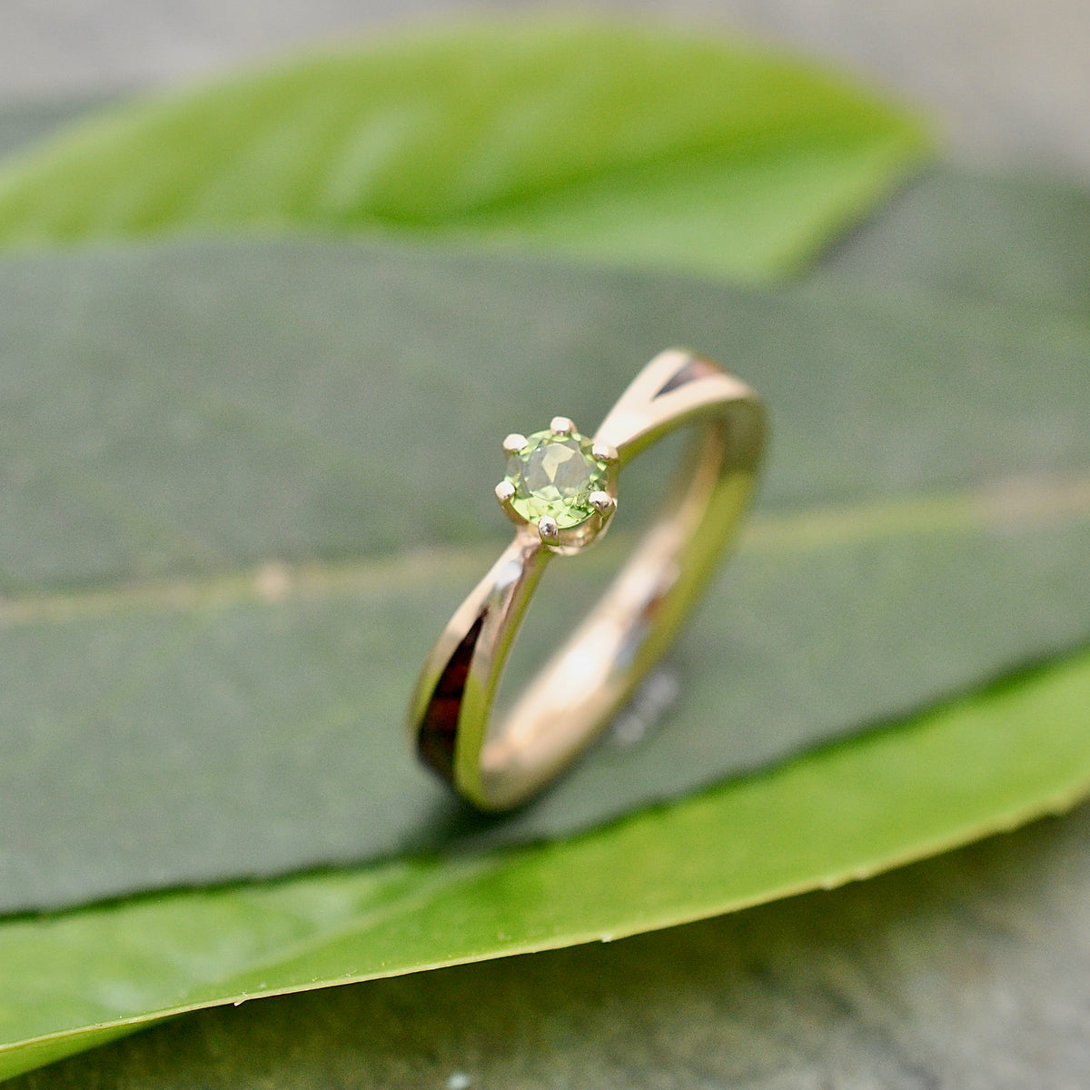 Moldavite solitaire wood engagement ring in yellow gold with wood inlay detail view