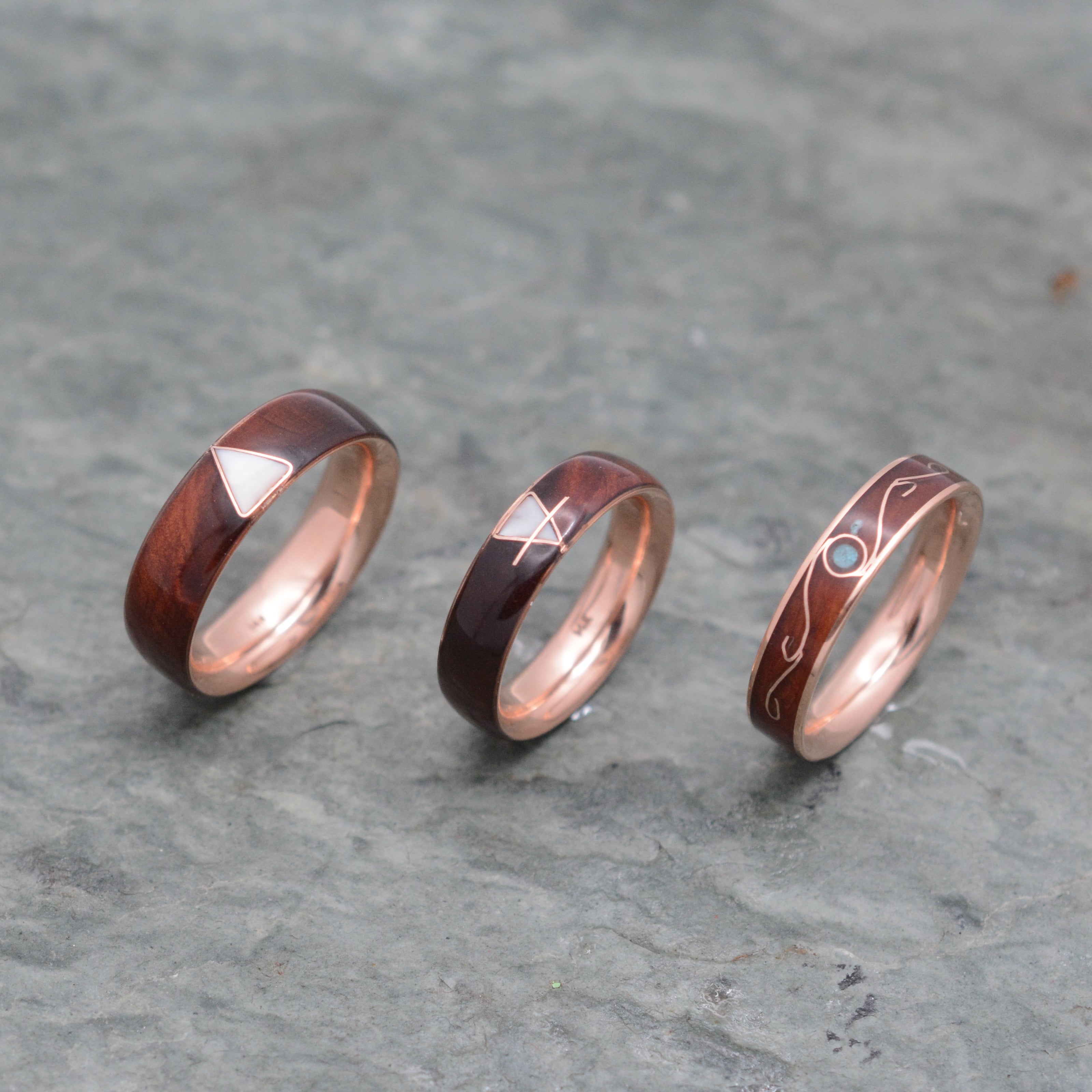 rose-gold-custom-symbol-wood-wedding-rings.jpeg