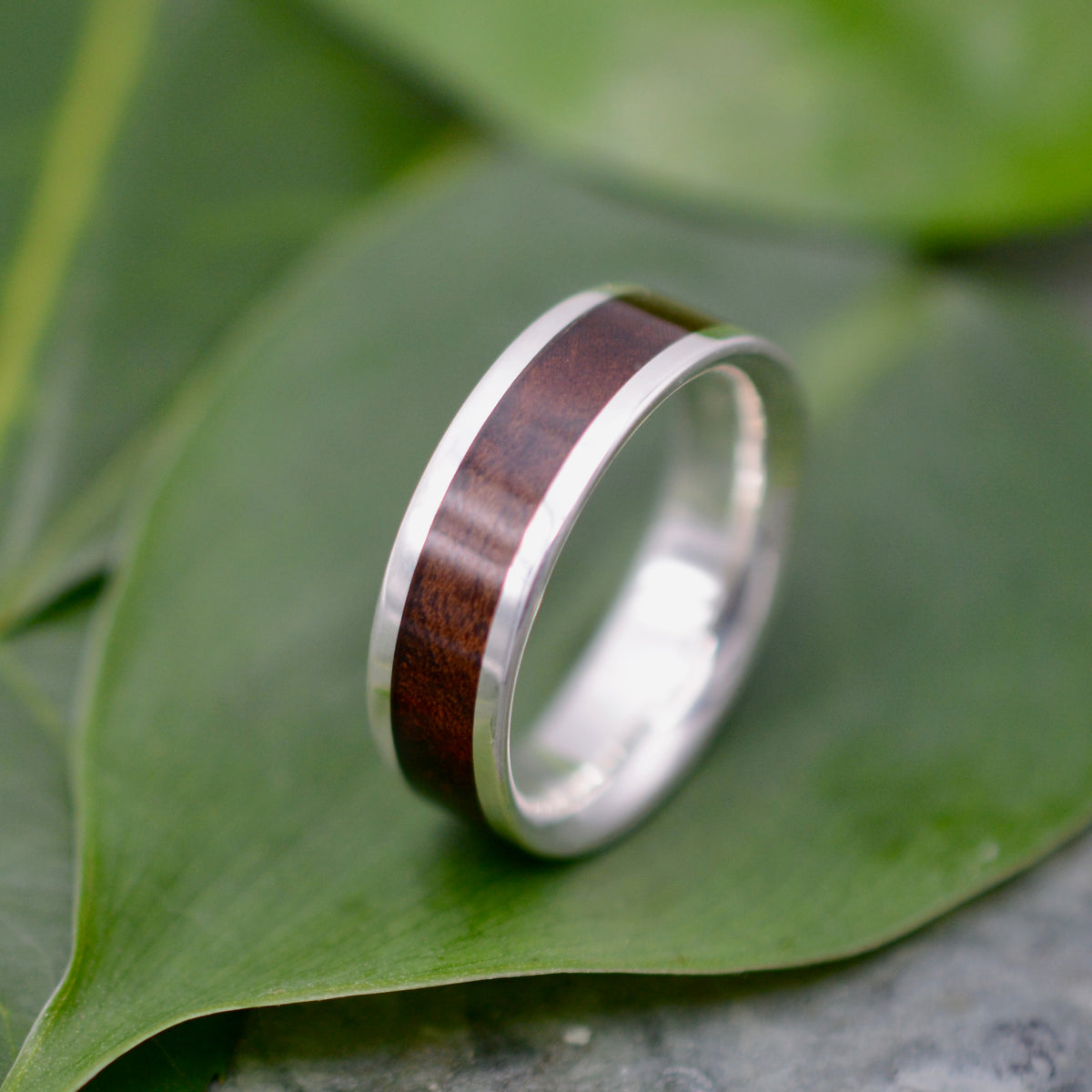 Handcrafted wood and sterling silver wedding band with laurel macho wood