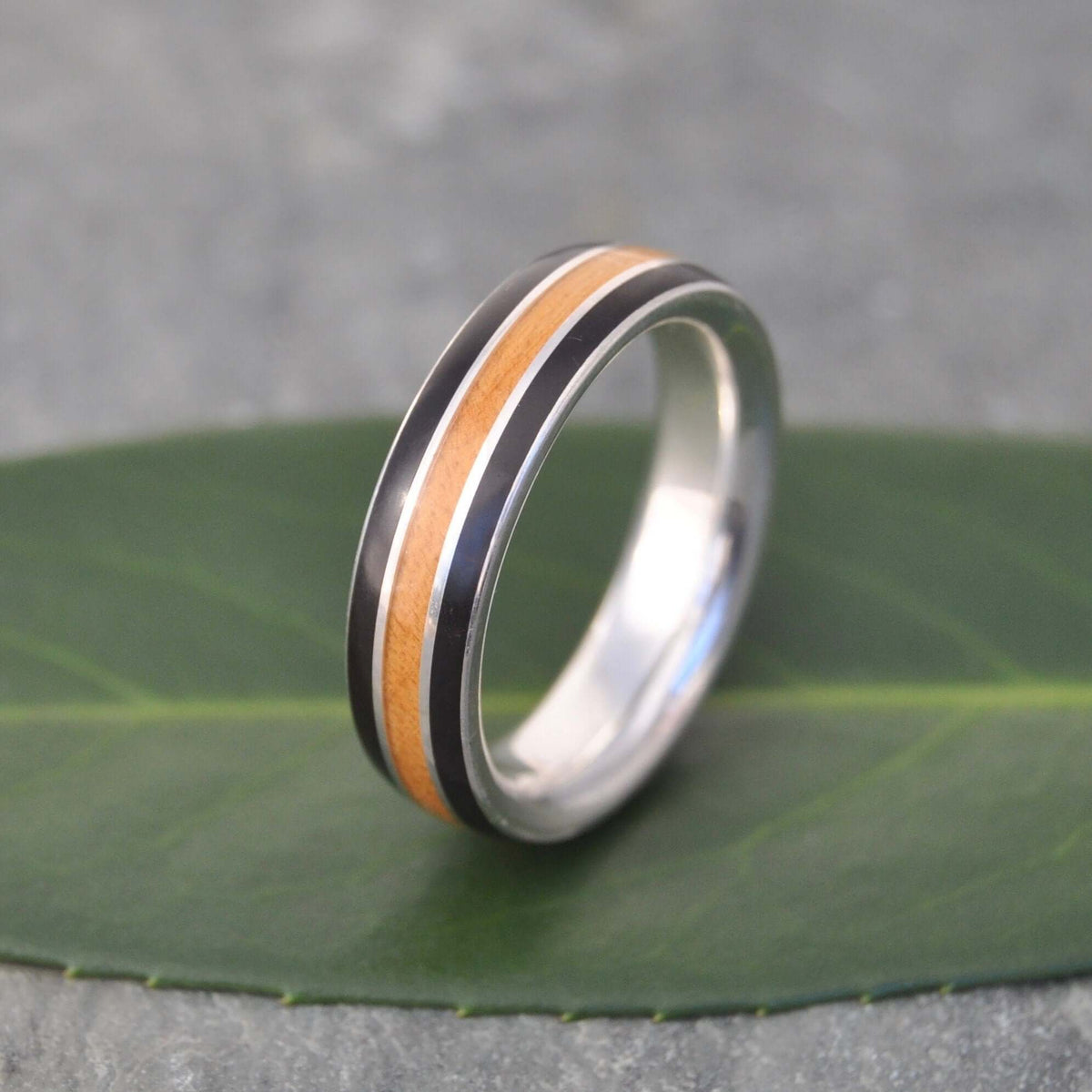 Unique silver and wood ring with coyol seed and moran wood contrast