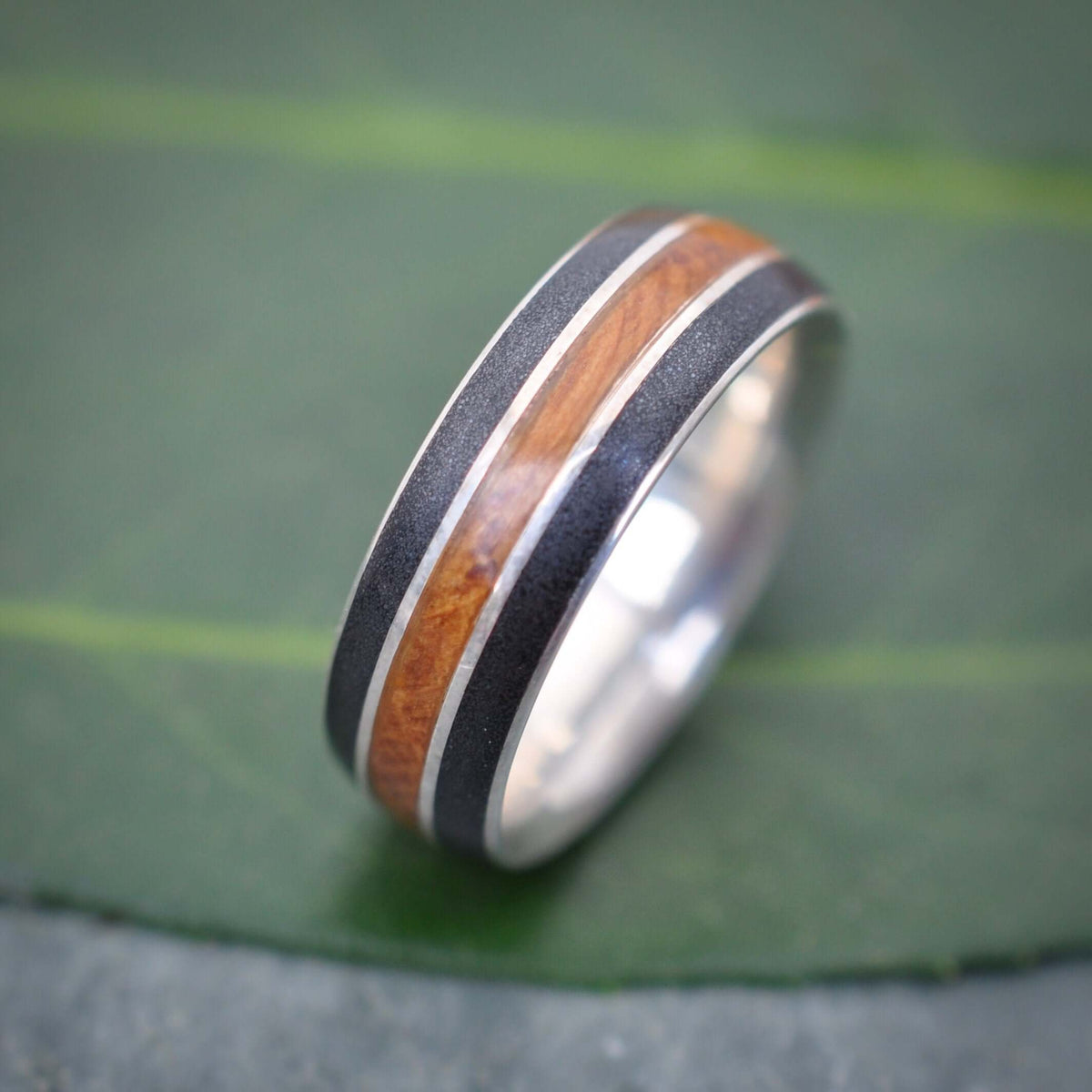 Juntos bourbon barrel and titanium sand wood wedding band