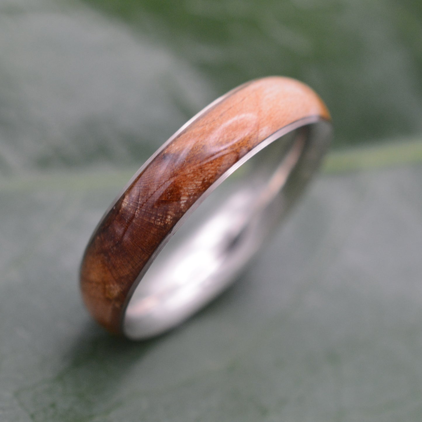 a close up of a ring on a leaf