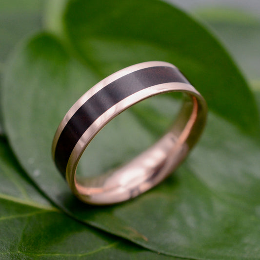 a wedding band with a black and white stripe