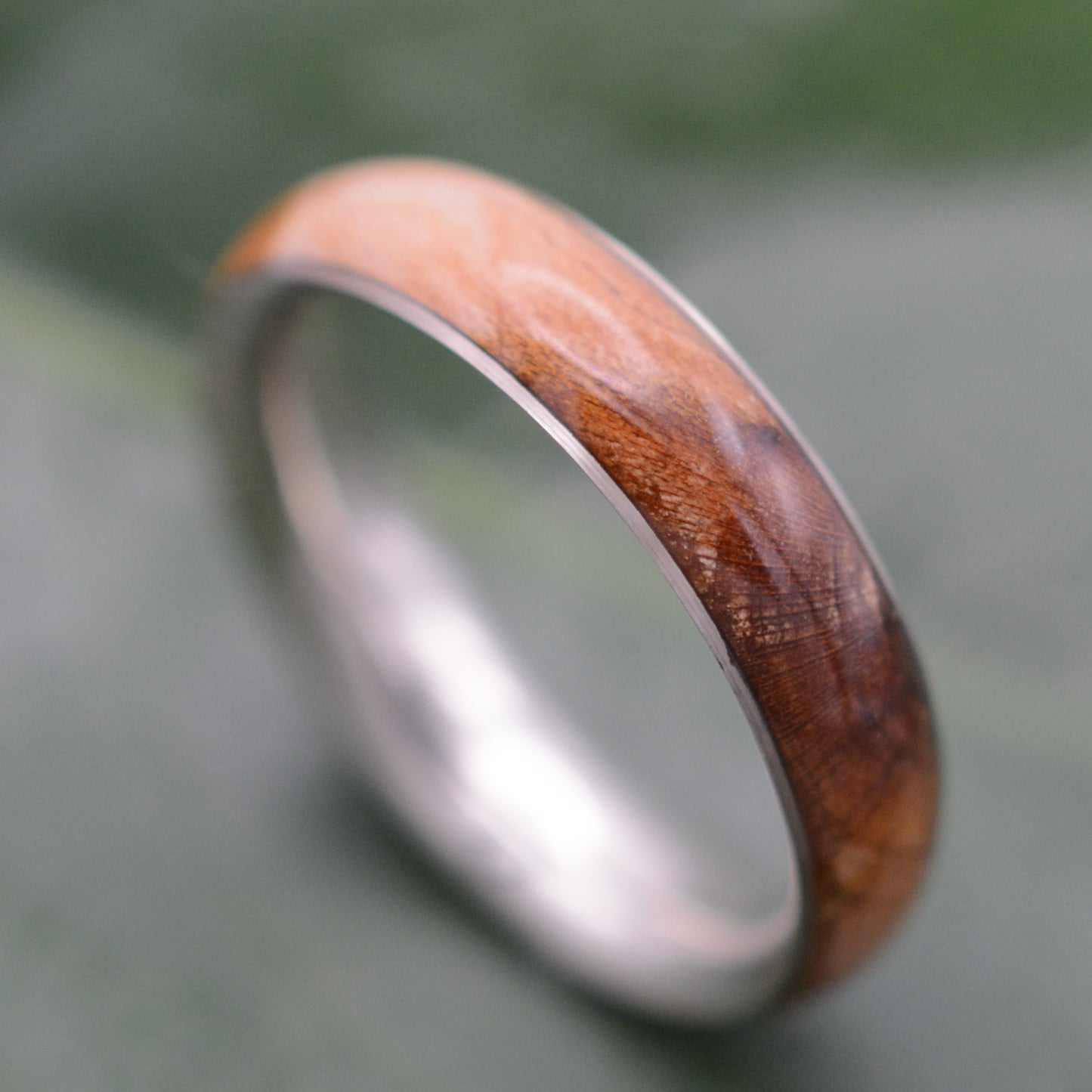 a wedding ring with a wooden inlay