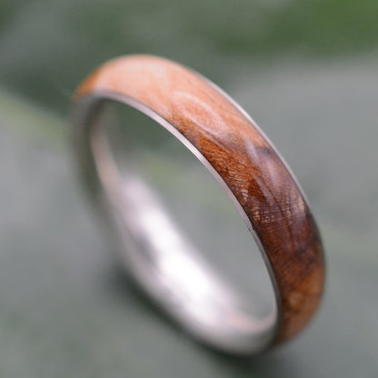 a wedding ring with a wooden inlay