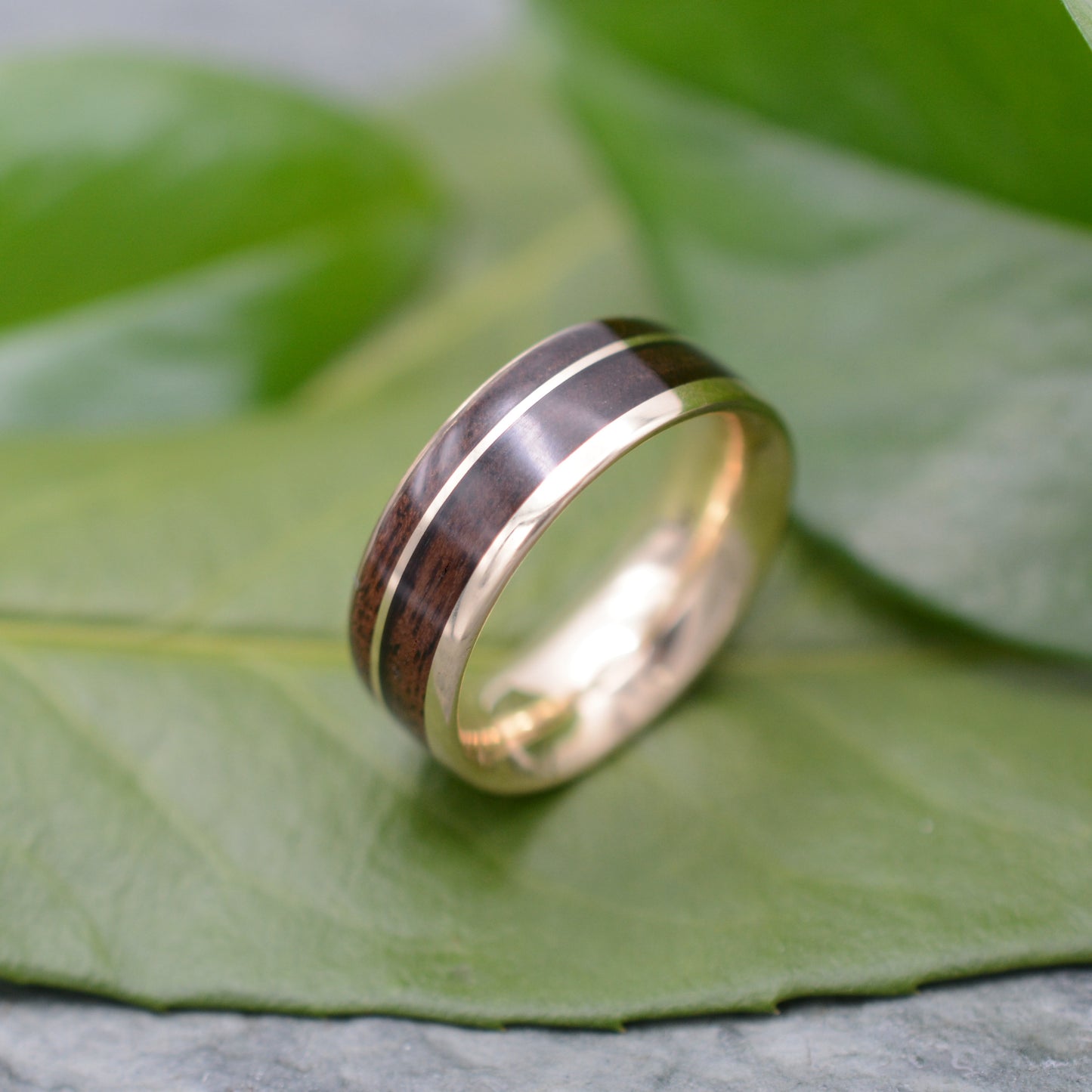 14k recycled gold and walnut wood ring with asymmetric Un Lado Asi design
