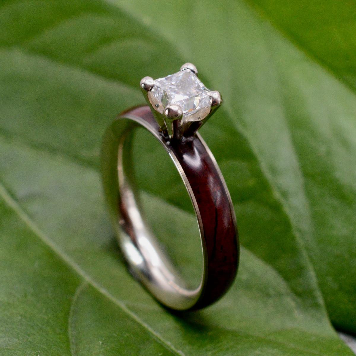 Princess cut diamond wood engagement ring with cocobolo wood band close up of grain