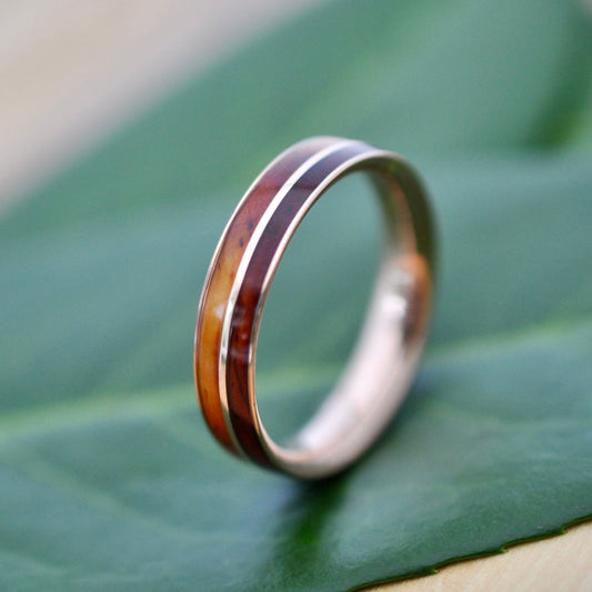 Wood and gold wedding ring in cocobolo with solid 14k yellow gold lining.