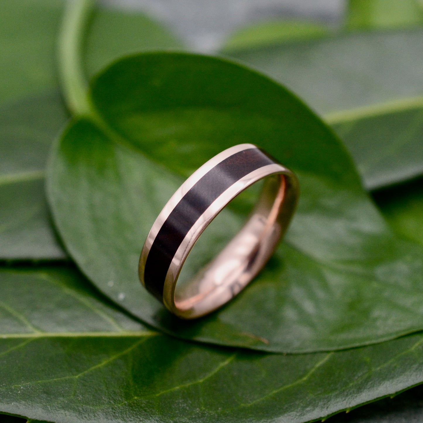 Comfort fit rose gold and rosewood wedding band with Lados design