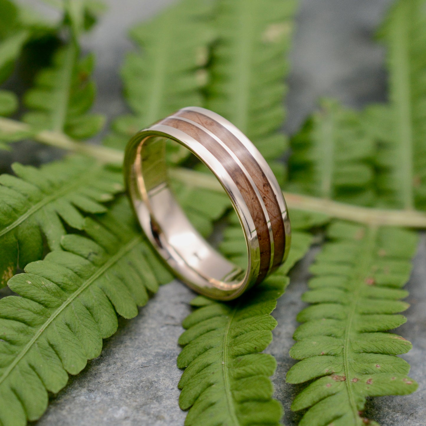 Custom made-to-order bourbon barrel wood wedding band with yellow gold