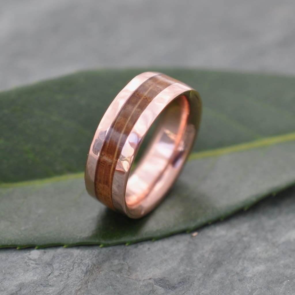 Comfort fit bourbon barrel ring with hammered rose gold edges