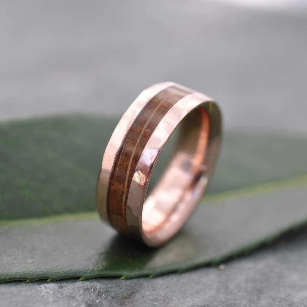 Reclaimed bourbon barrel wedding ring with hand-textured hammered rose gold