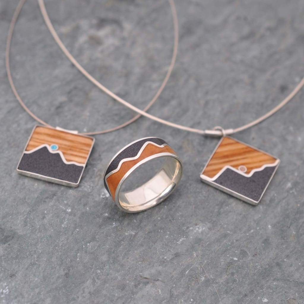 Mountain wood pendant showing turquoise stone and barrel wood detail