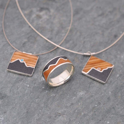 Mountain wood pendant showing turquoise stone and barrel wood detail