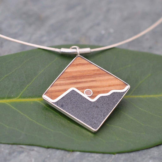 Wood mountain necklace with abalone inlay and bourbon barrel wood