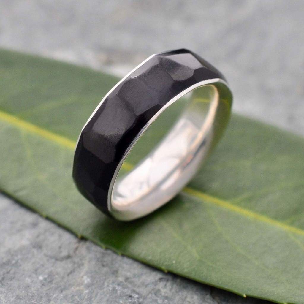 Ethically made coyol wood wedding band with hand-carved texture and silver