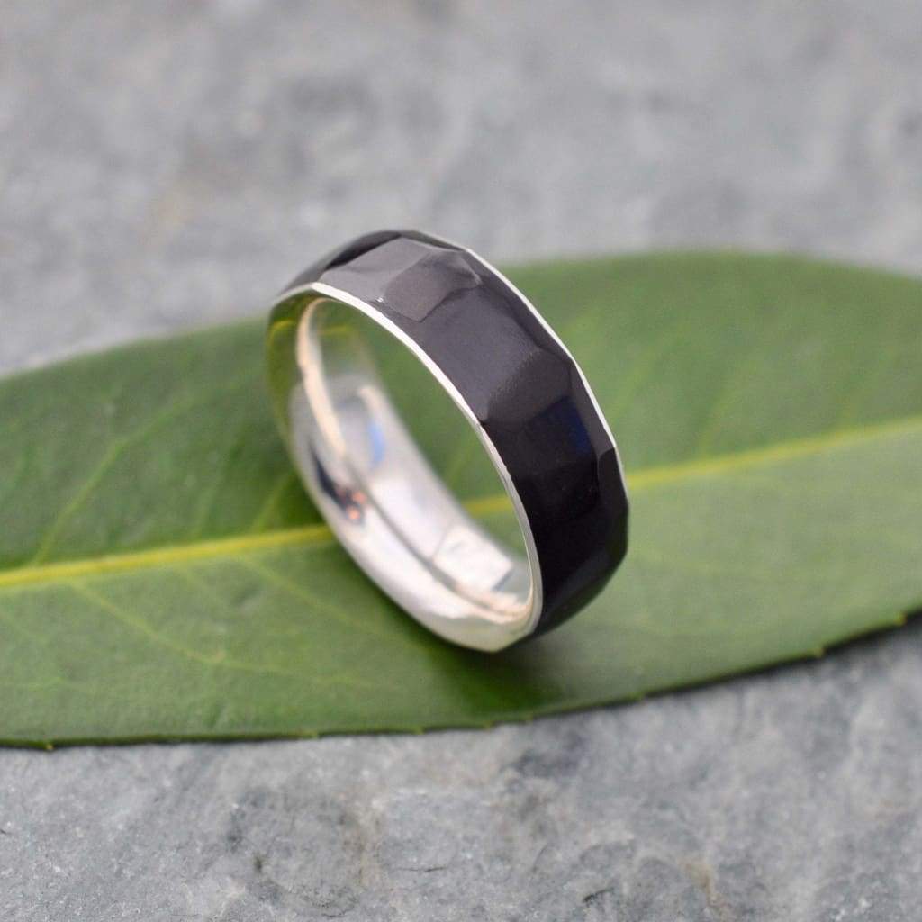 Hand-carved black coyol wedding band with sterling silver comfort fit band