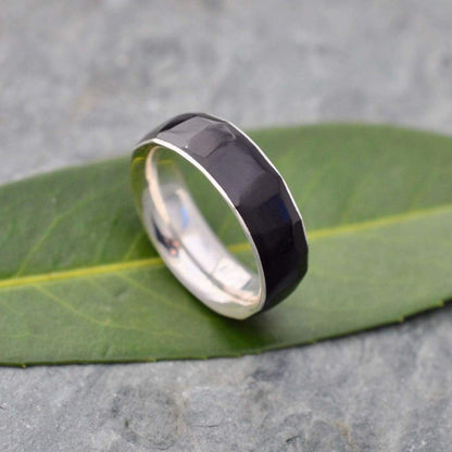 Hand-carved black coyol wedding band with sterling silver comfort fit band