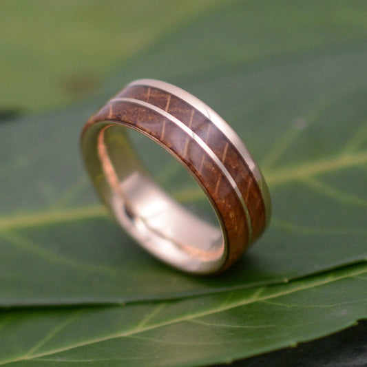 Un Lado Asi bourbon barrel ring with rose gold offset stripe and interior