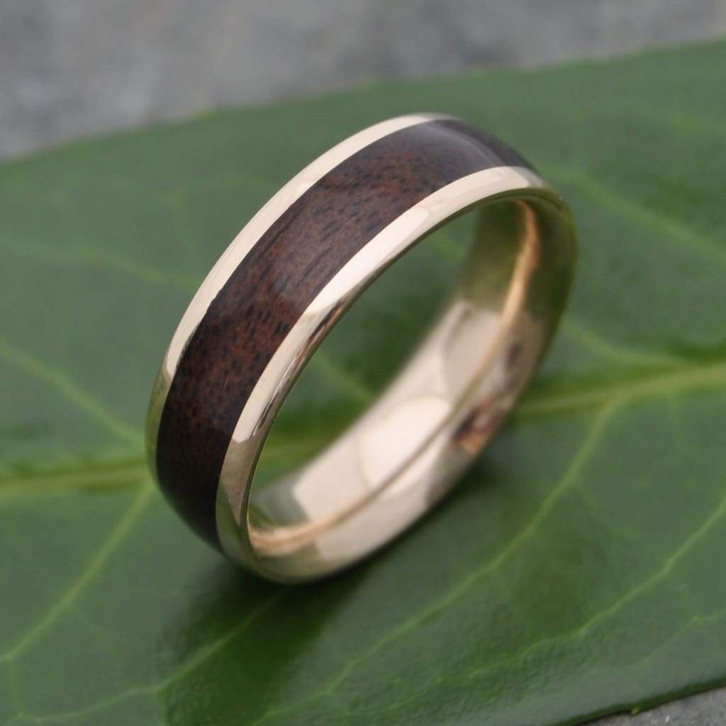 Rustic walnut wood wedding band with 14k recycled solid yellow gold core.