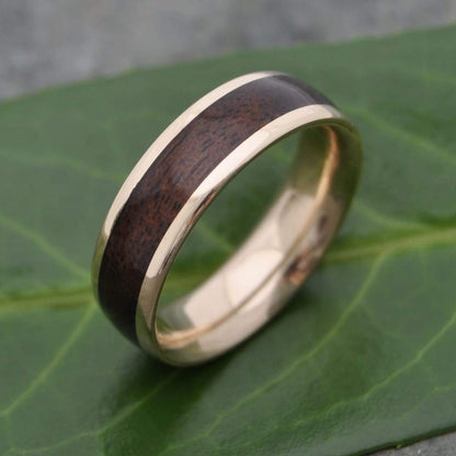 Rustic walnut wood wedding band with 14k recycled solid yellow gold core.
