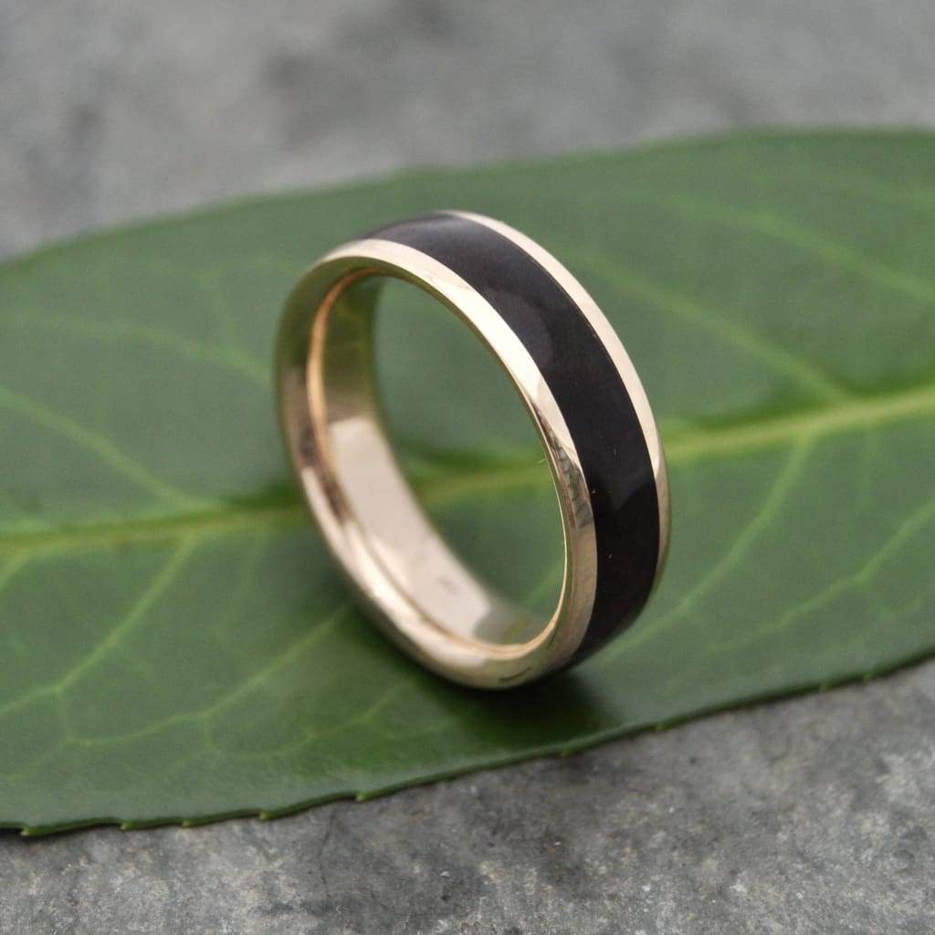 Natural walnut wood grain ring with 14k recycled yellow gold center.