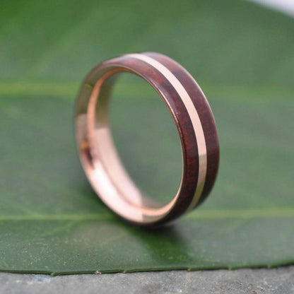 Mens rose gold wood wedding band with natural Guapinol wood grain