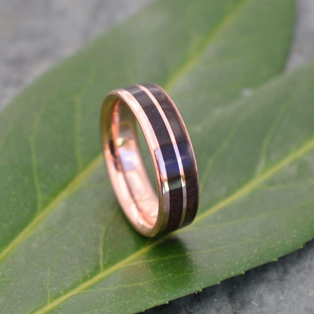 Asymmetric Un Lado Asi walnut ring with rose gold offset stripe