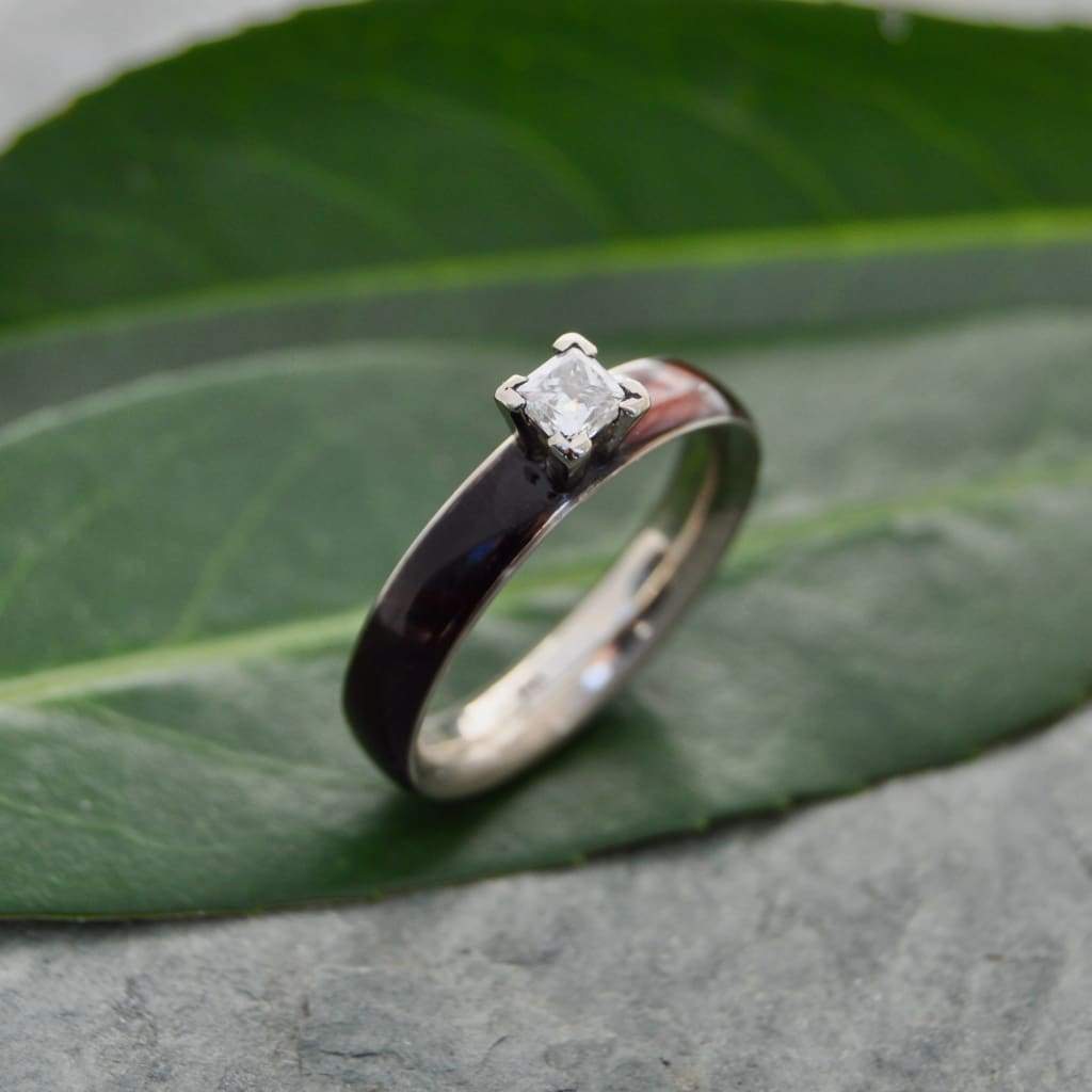 Princess cut diamond wood engagement ring with koa wood and white gold close up of grain